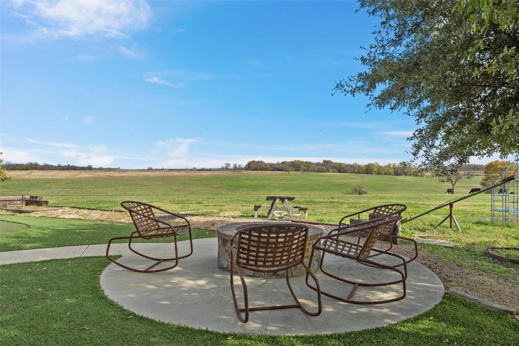 1170 Lumkins Road Forreston, TX 76041 - Photo 19 of 40 a view of a swimming pool and lounge chair