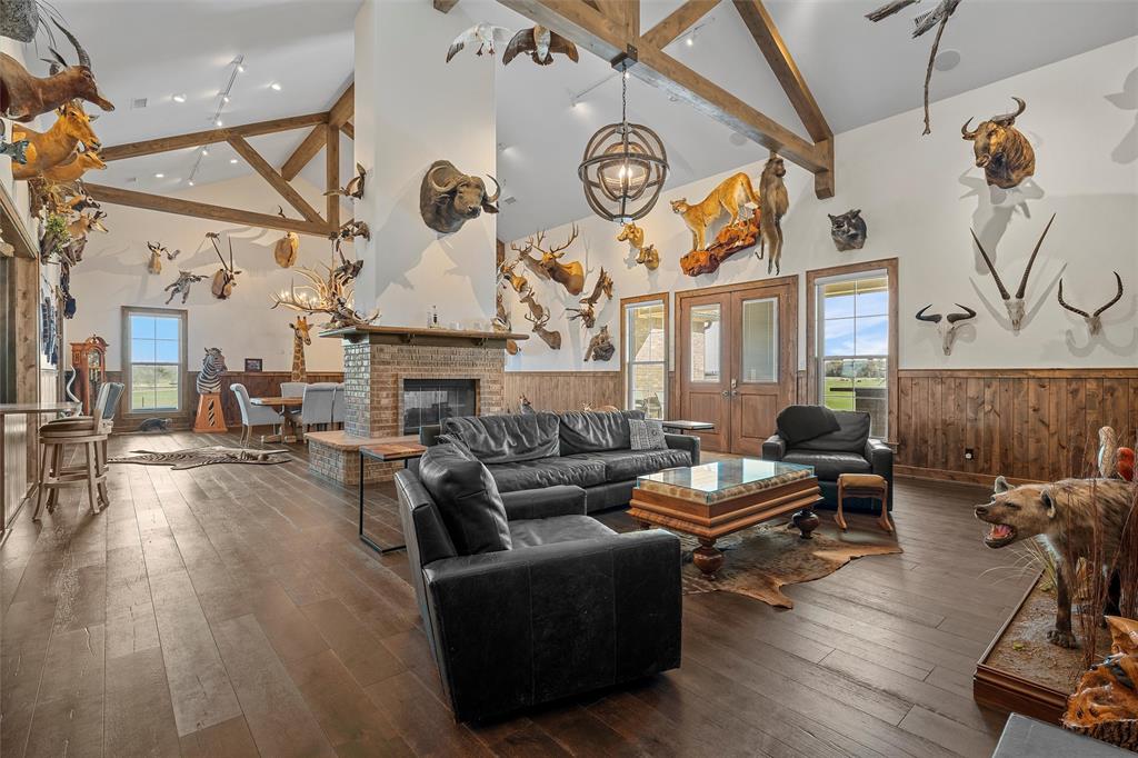 1170 Lumkins Road Forreston, TX 76041 - Photo 4 of 40 a living room with fireplace furniture and a wooden floor