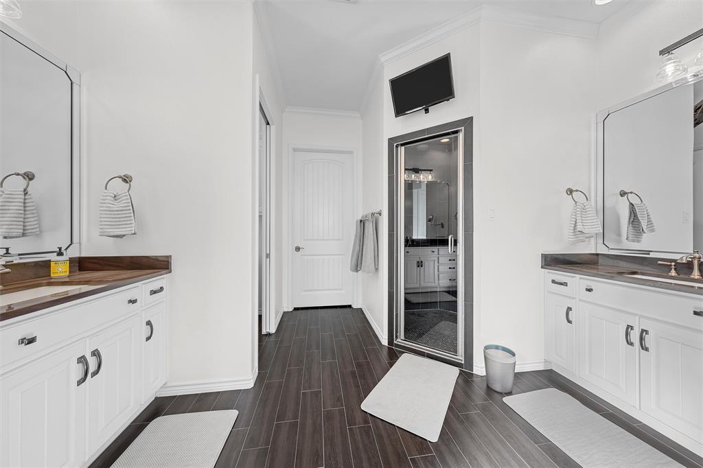 1170 Lumkins Road Forreston, TX 76041 - Photo 10 of 40 a spacious bathroom with a granite countertop sink and a mirror