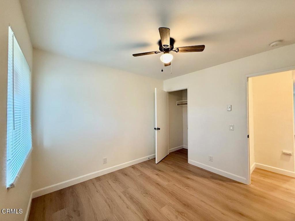 225 South Ventura Road, Unit 79 Port Hueneme, CA 93041 - Photo 12 of 28 a view of empty room with wooden floor and fan