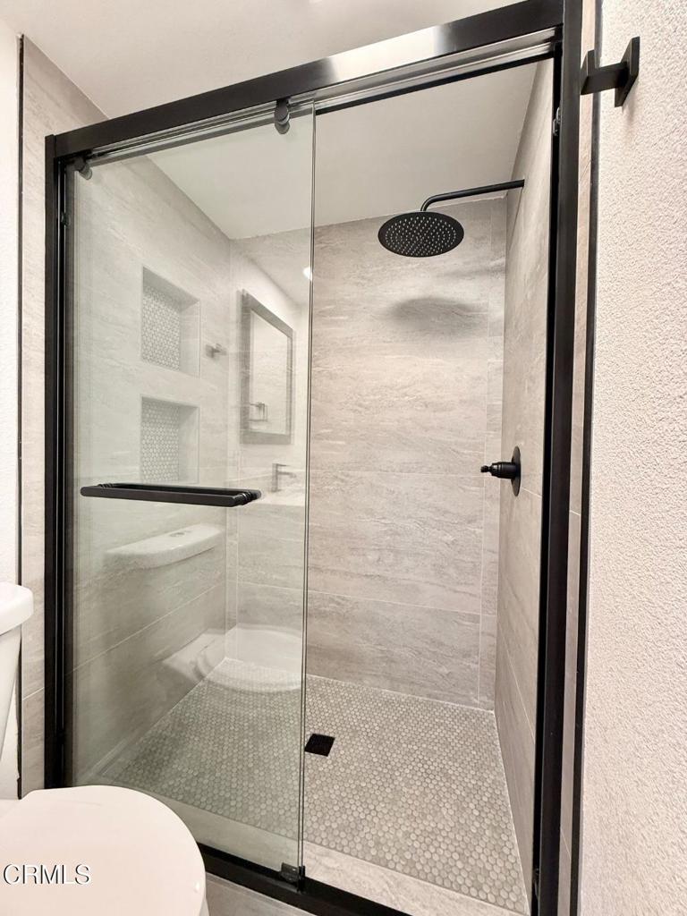 225 South Ventura Road, Unit 79 Port Hueneme, CA 93041 - Photo 20 of 28 a bathroom with a glass shower door