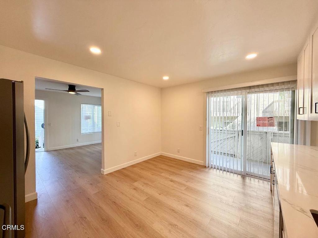 225 South Ventura Road, Unit 79 Port Hueneme, CA 93041 - Photo 5 of 28 wooden floor in an empty room with a window