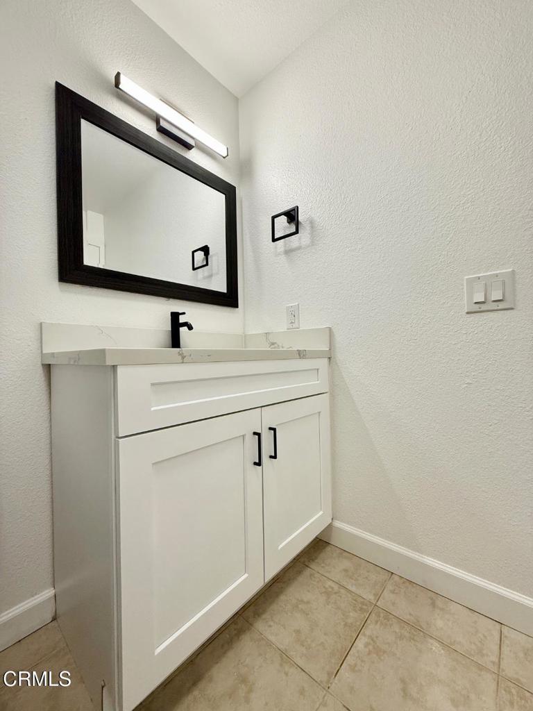 225 South Ventura Road, Unit 79 Port Hueneme, CA 93041 - Photo 10 of 28 a bathroom with a sink vanity and mirror