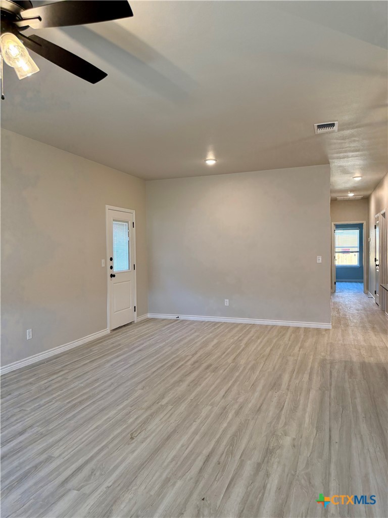 110 Leon Lane Copperas Cove, TX 76522 - Photo 17 of 20 an empty room with wooden floor and windows
