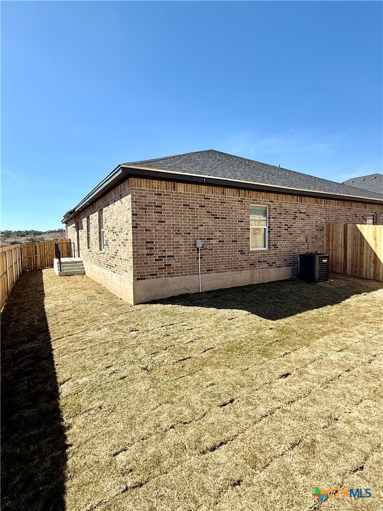 110 Leon Lane Copperas Cove, TX 76522 - Photo 19 of 20 a view of wooden fence and a yard