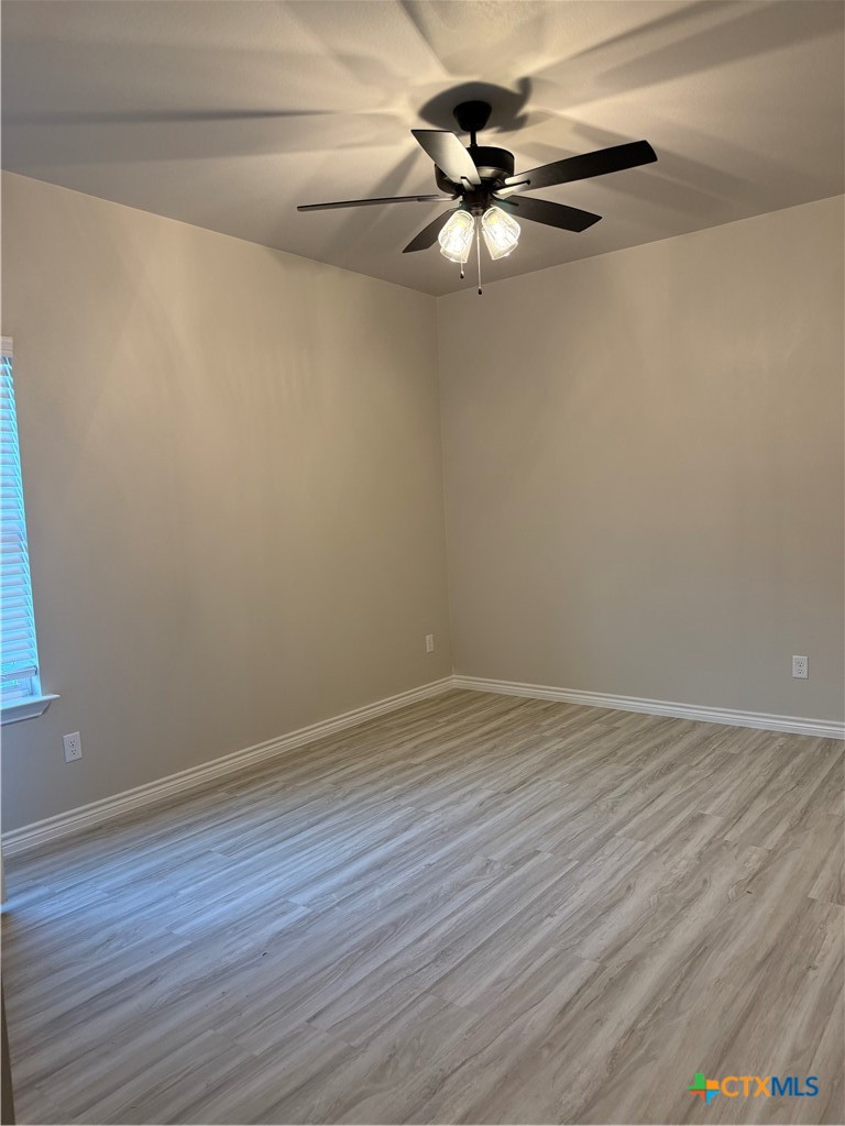 110 Leon Lane Copperas Cove, TX 76522 - Photo 8 of 20 a view of a room with wooden floor and window