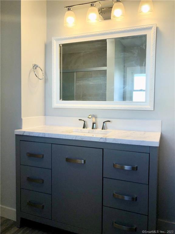 359 South Main Street, Unit 2 Middletown, CT 06457 - Photo 14 of 21 a bathroom with a sink and a mirror