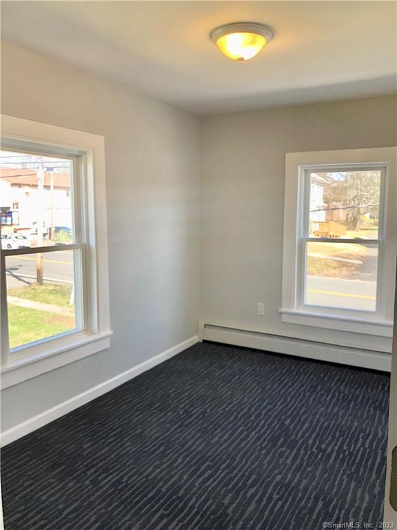 359 South Main Street, Unit 2 Middletown, CT 06457 - Photo 18 of 21 a view of an empty room with wooden floor and a window