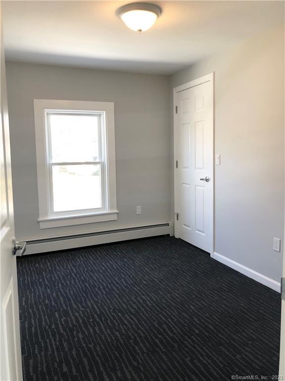 359 South Main Street, Unit 2 Middletown, CT 06457 - Photo 19 of 21 an empty room with wooden floor and window