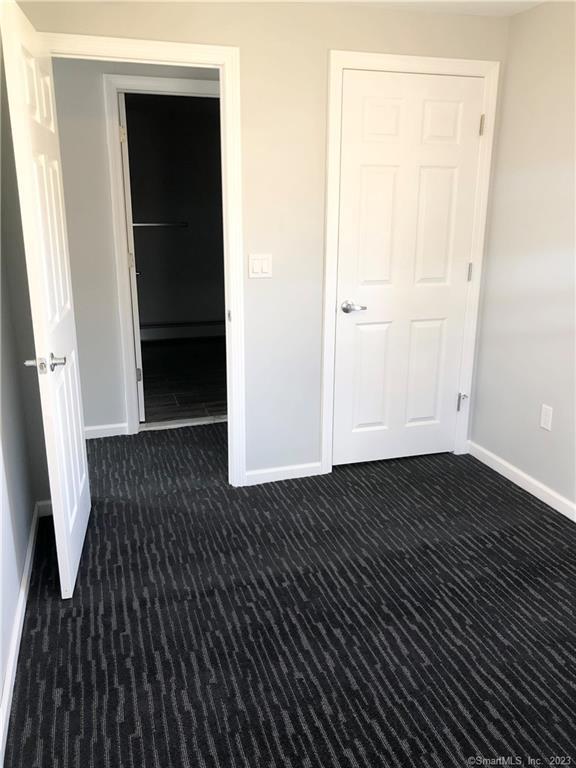 359 South Main Street, Unit 2 Middletown, CT 06457 - Photo 21 of 21 an empty room with wooden floor and entrance