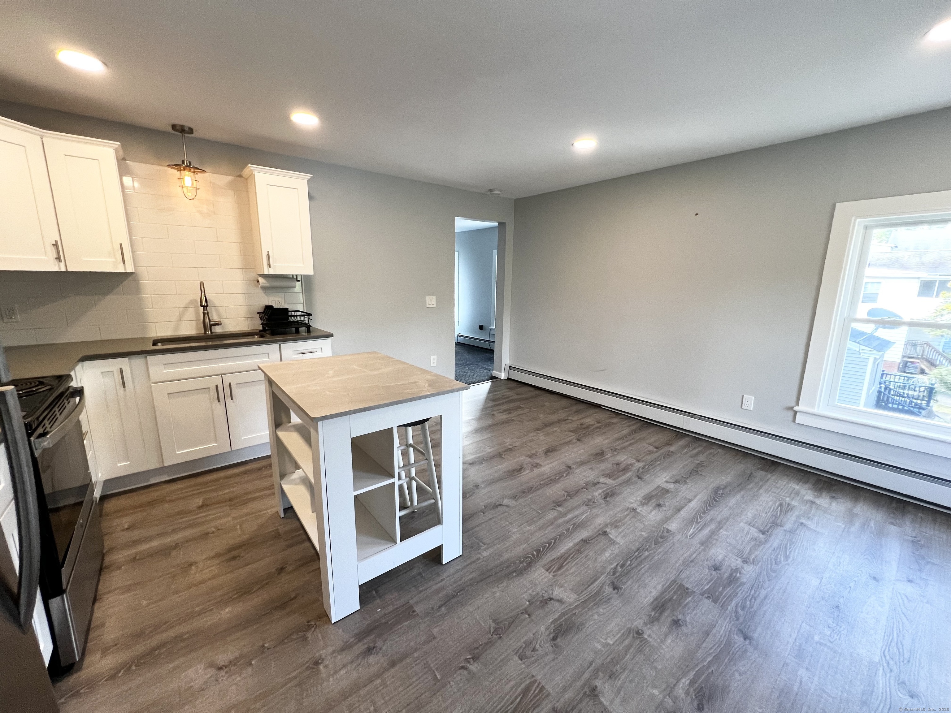 359 South Main Street, Unit 2 Middletown, CT 06457 - Photo 3 of 21 a kitchen with stainless steel appliances granite countertop a stove a sink and a refrigerator