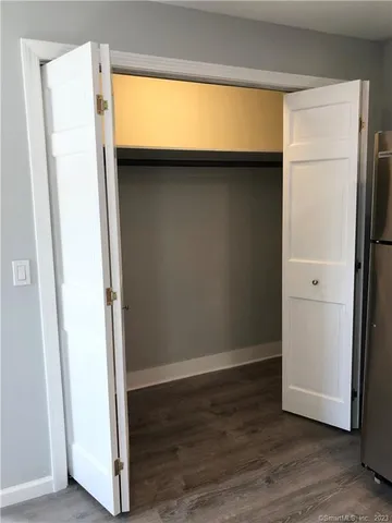 a view of front door with wooden floor