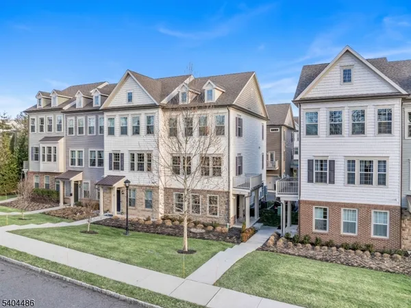 a view of a big house with a yard