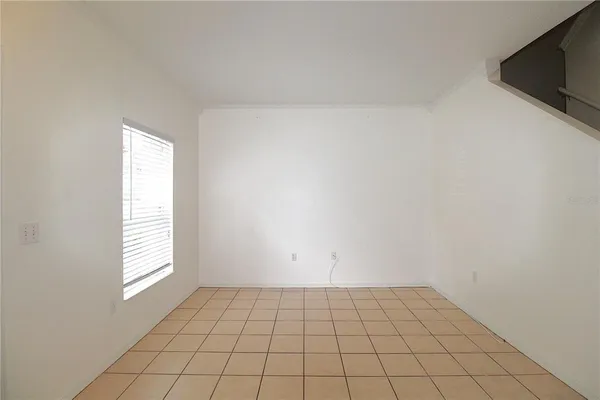 a view of an empty room and window