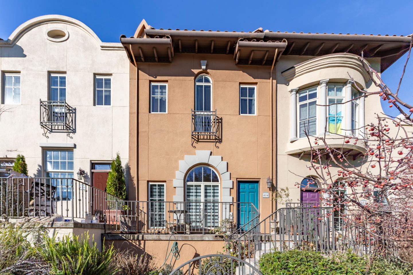 a front view of a house with many windows