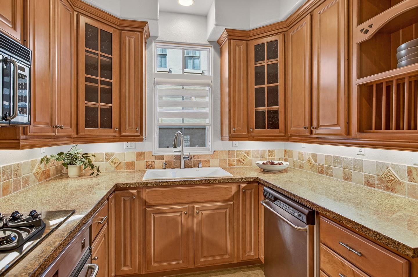 484 Gabilan Street Los Altos, CA 94022 - Photo 12 of 34 a kitchen with a sink and cabinets