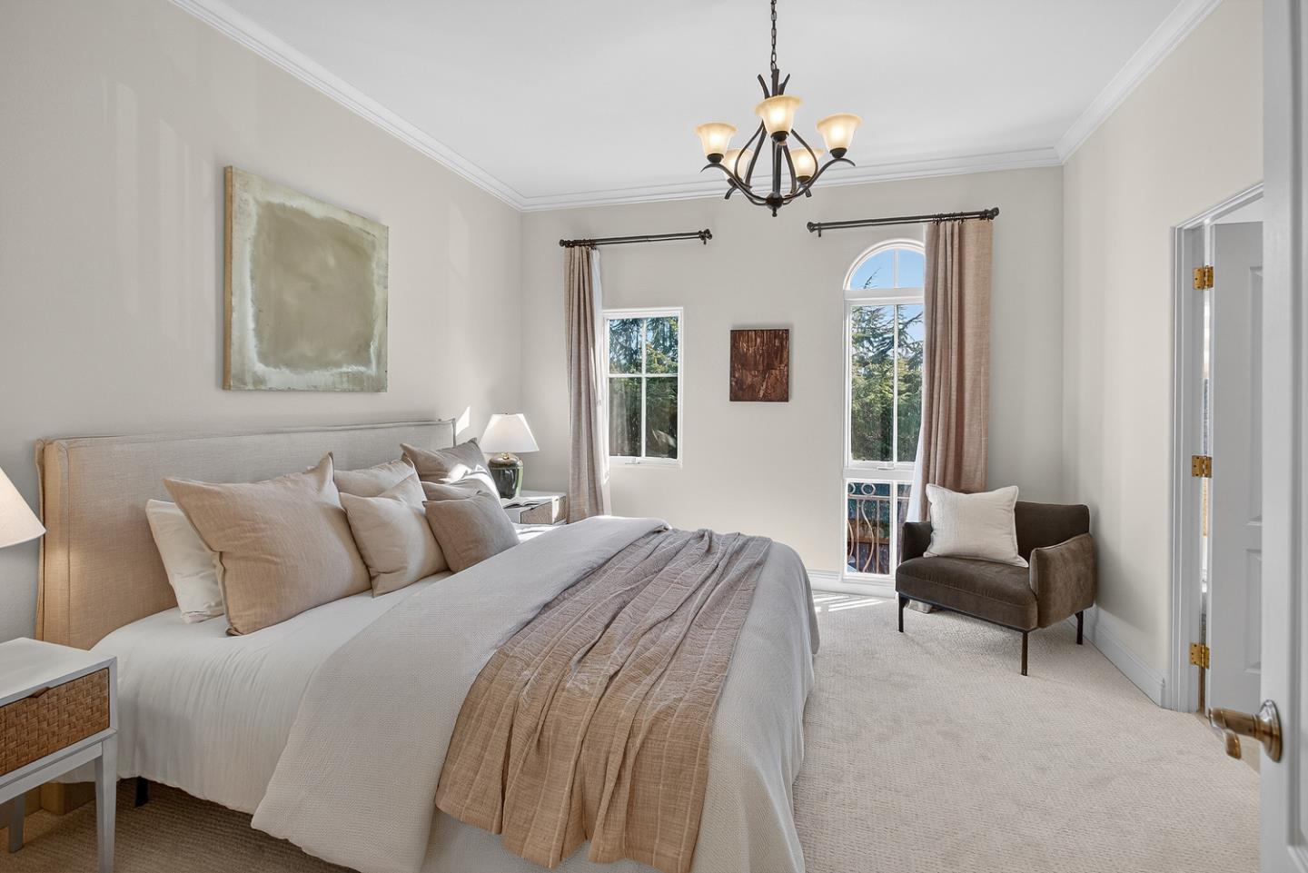 484 Gabilan Street Los Altos, CA 94022 - Photo 14 of 34 a bedroom with a bed and a chandelier