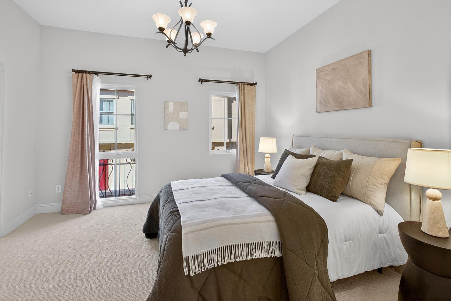 484 Gabilan Street Los Altos, CA 94022 - Photo 20 of 34 a bedroom with a bed and a chandelier