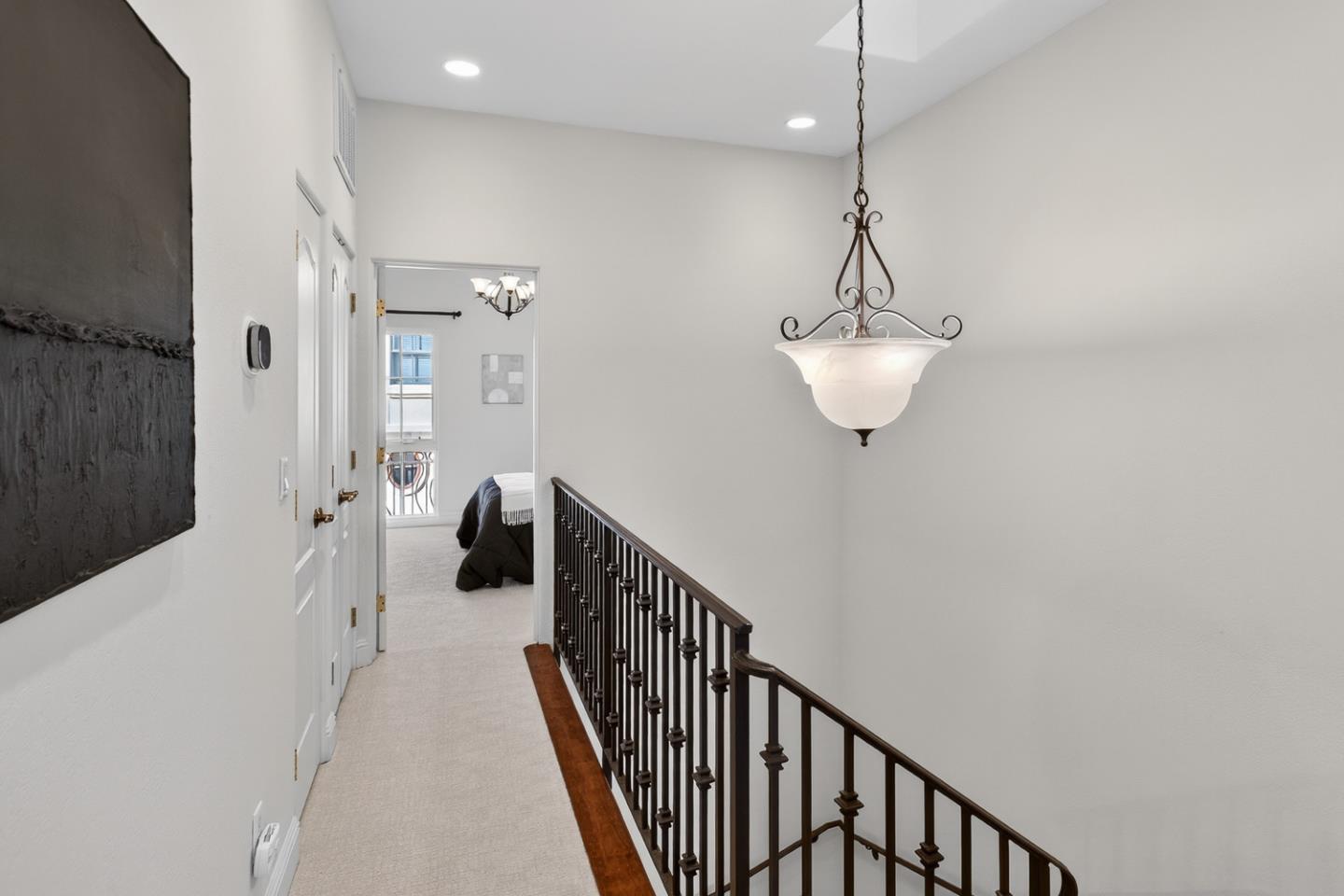 484 Gabilan Street Los Altos, CA 94022 - Photo 24 of 34 a view of a hallway with wooden floor and staircase