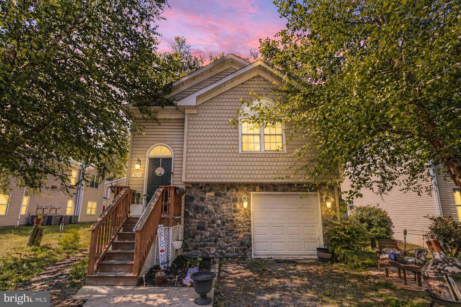 317 12th Street Colonial Beach, VA 22443 - Photo 1 of 28 a front view of a house with a yard