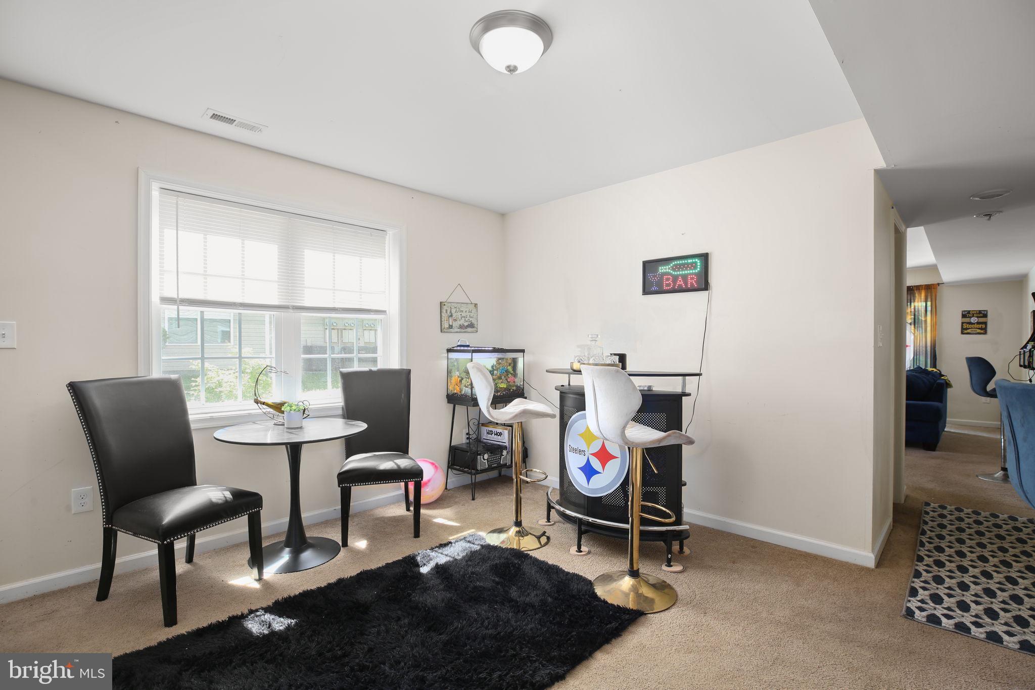 317 12th Street Colonial Beach, VA 22443 - Photo 17 of 28 a view of a livingroom with furniture and a window
