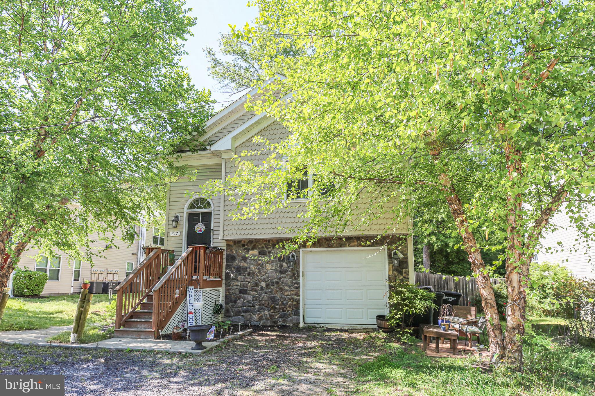 317 12th Street Colonial Beach, VA 22443 - Photo 28 of 28 a front view of a house with garden