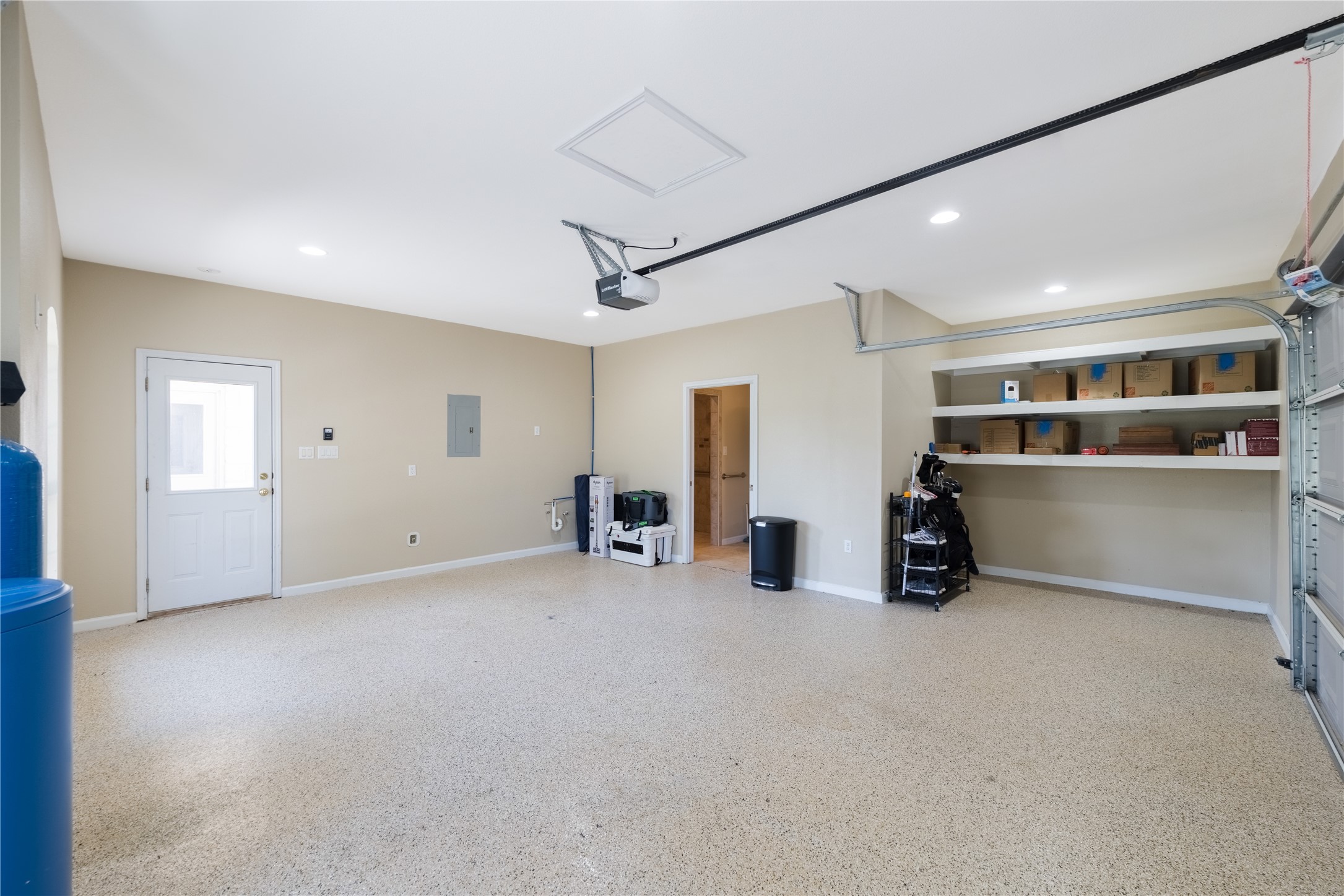 20145 Janak Road Coupland, TX 78615 - Photo 26 of 40 Ample garage space featuring built-in storage and convenient access points.