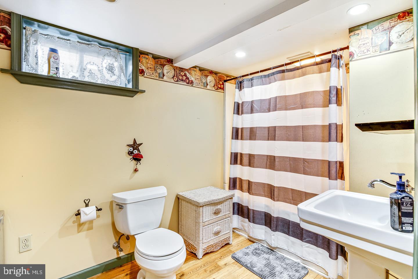 866 Allentown Road Telford, PA 18969 - Photo 17 of 26 a white toilet sitting next to a bathroom sink