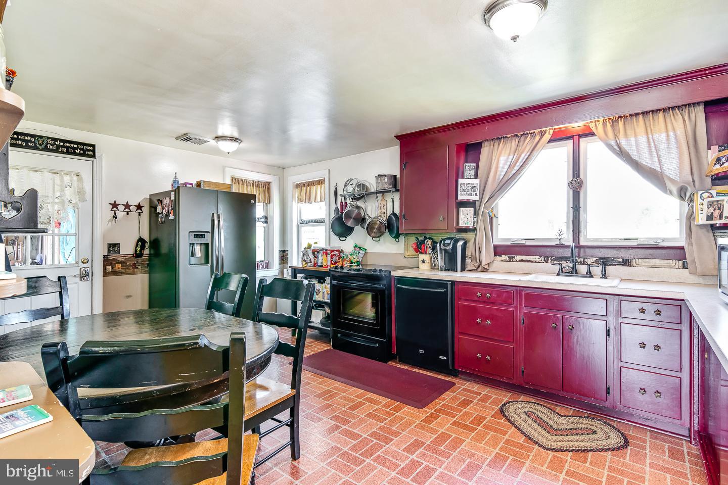 866 Allentown Road Telford, PA 18969 - Photo 5 of 26 a kitchen with a stove a sink and a refrigerator