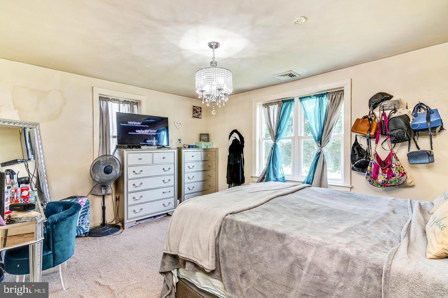 866 Allentown Road Telford, PA 18969 - Photo 7 of 26 a bedroom with furniture a chandelier and a closet