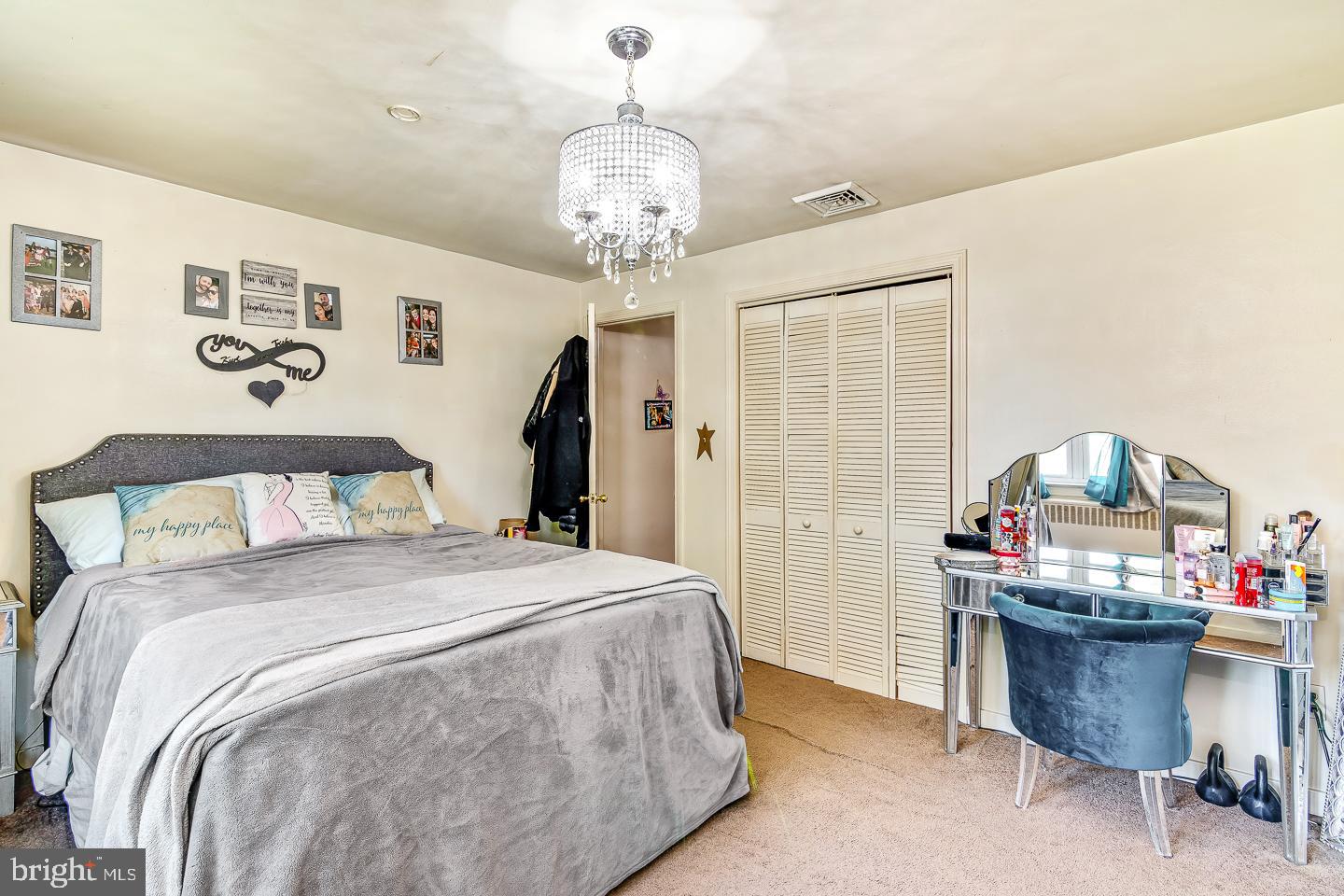 866 Allentown Road Telford, PA 18969 - Photo 8 of 26 a bed room with a bed and a chandelier