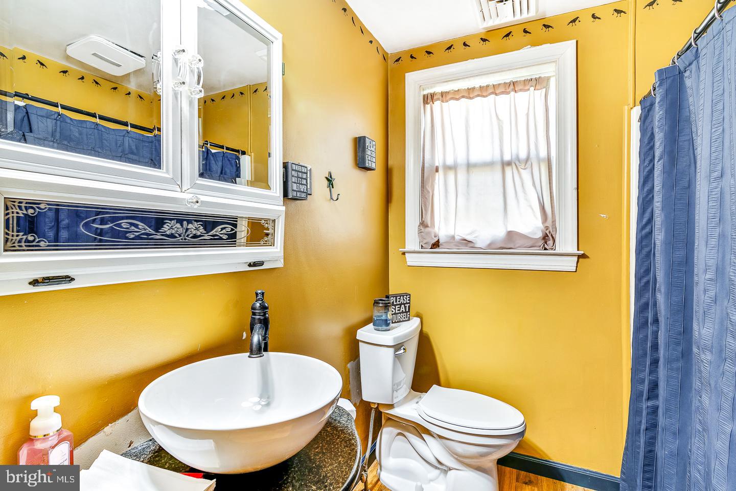 866 Allentown Road Telford, PA 18969 - Photo 10 of 26 a bathroom with a toilet sink and mirror