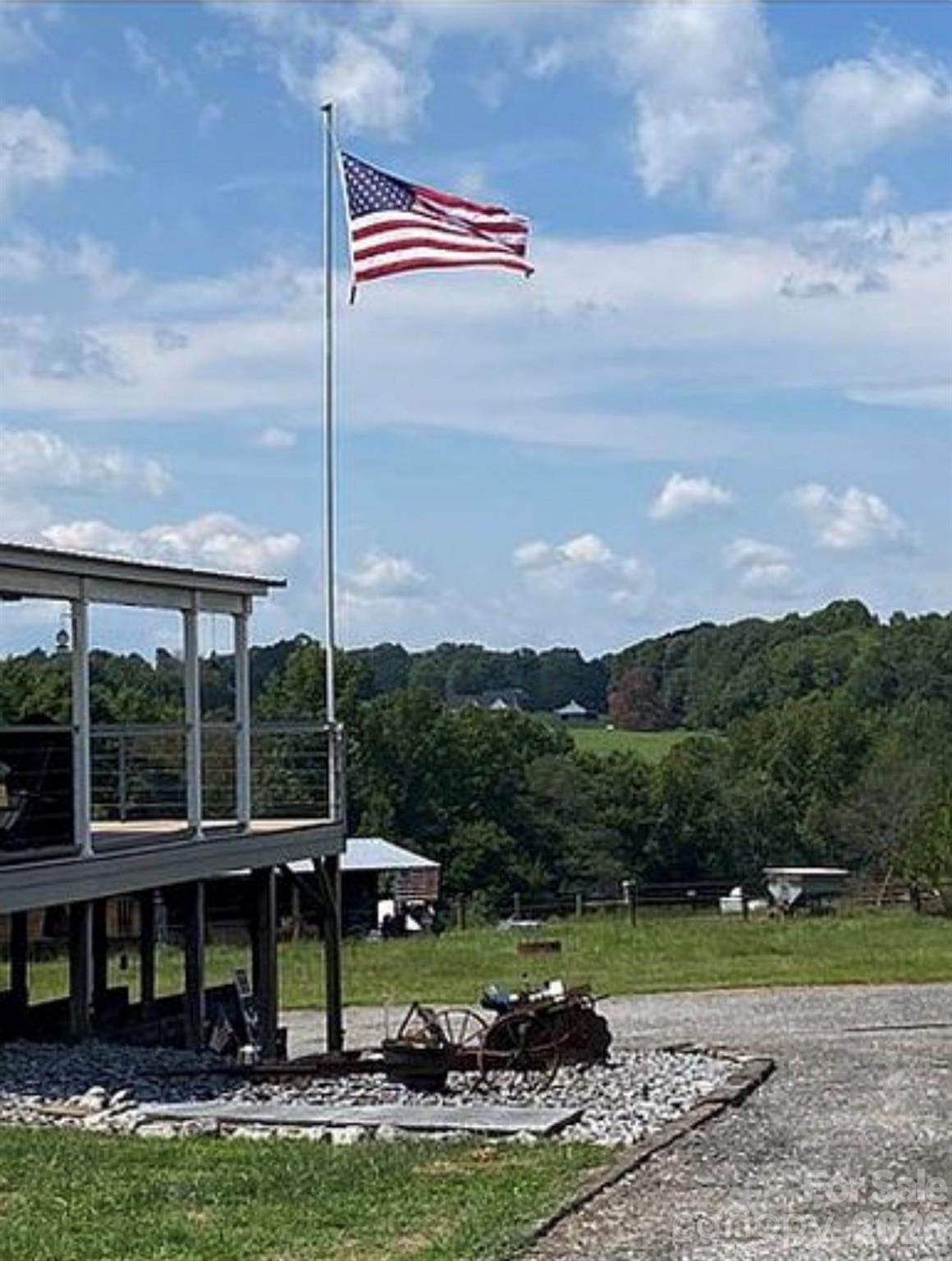 6042 Heavner Road Vale, NC 28168 - Photo 19 of 27 a view of a swimming pool and trees in the background