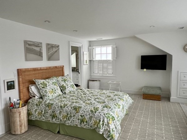 19 Morse Street Edgartown, MA 02539 - Photo 6 of 8 a bedroom with a bed and a flat screen tv