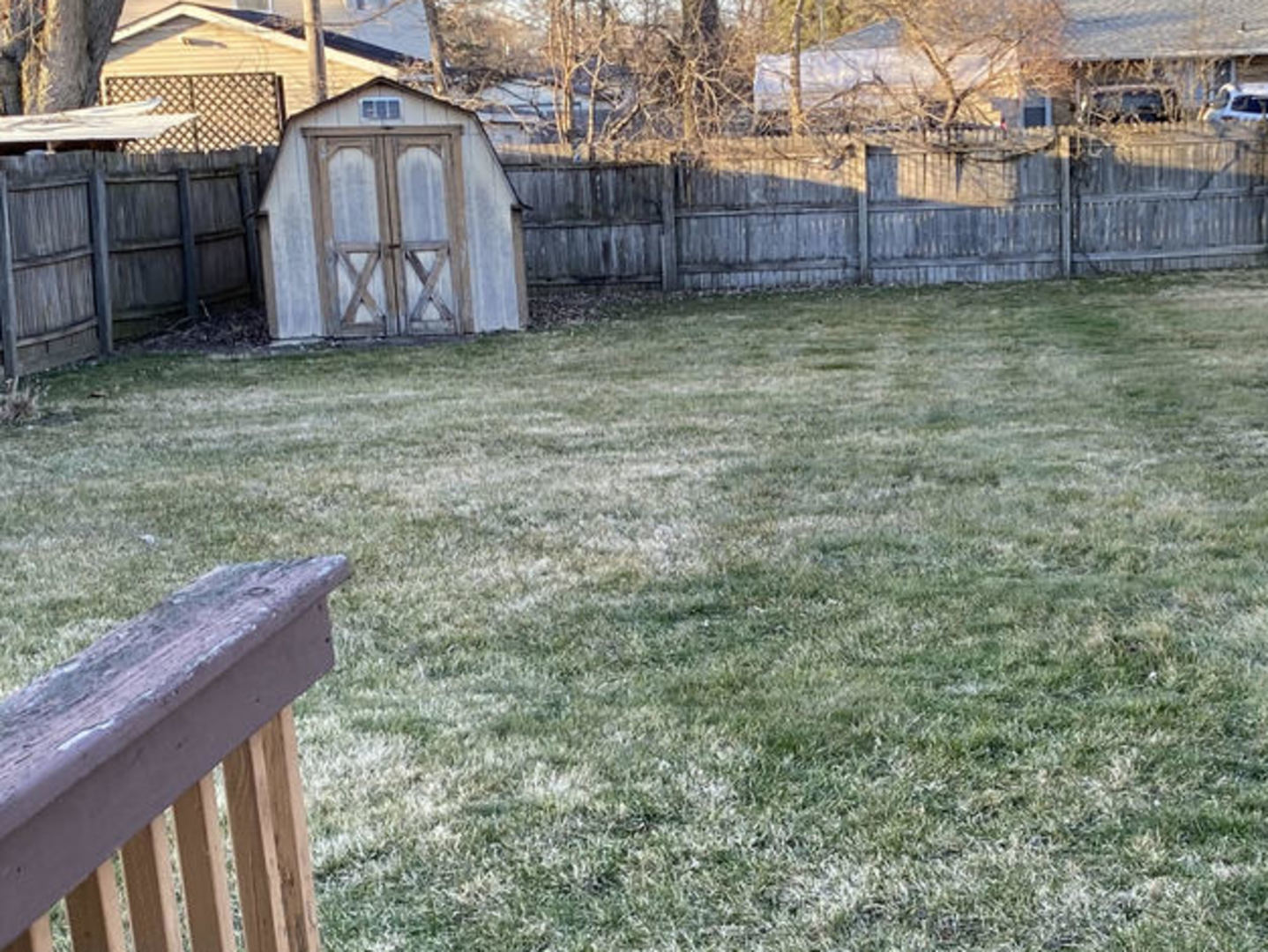 307 Cameron Avenue Lockport, IL 60441 - Photo 6 of 17 a view of a backyard with a wooden fence