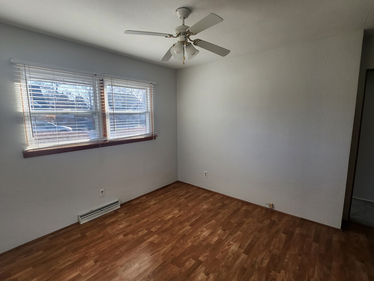 307 Cameron Avenue Lockport, IL 60441 - Photo 9 of 17 an empty room with a window and a fan
