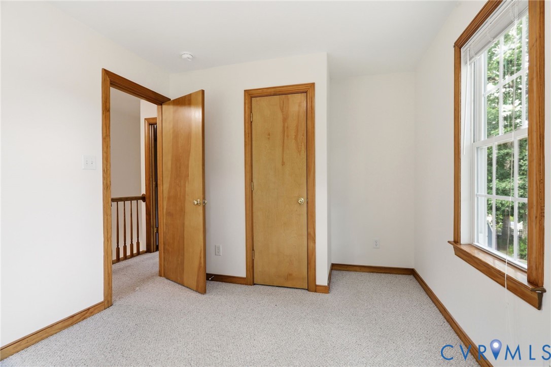 14420 Branding Iron Road Chesterfield, VA 23838 - Photo 33 of 50 Carpeted room featuring natural wood trim, a singl