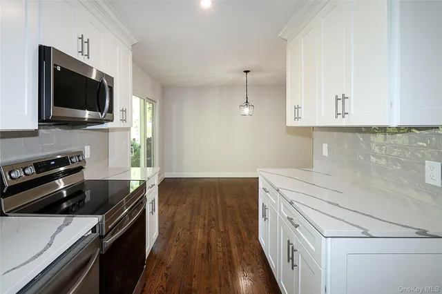 a kitchen with a stove and a microwave
