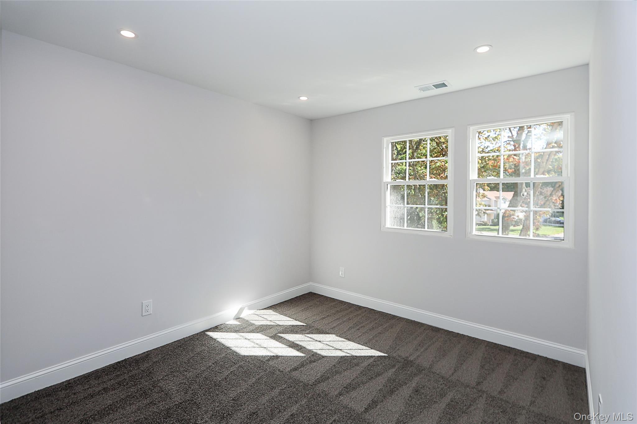 10 Smith Yaphank, NY 11980 - Photo 19 of 26 an empty room with a window