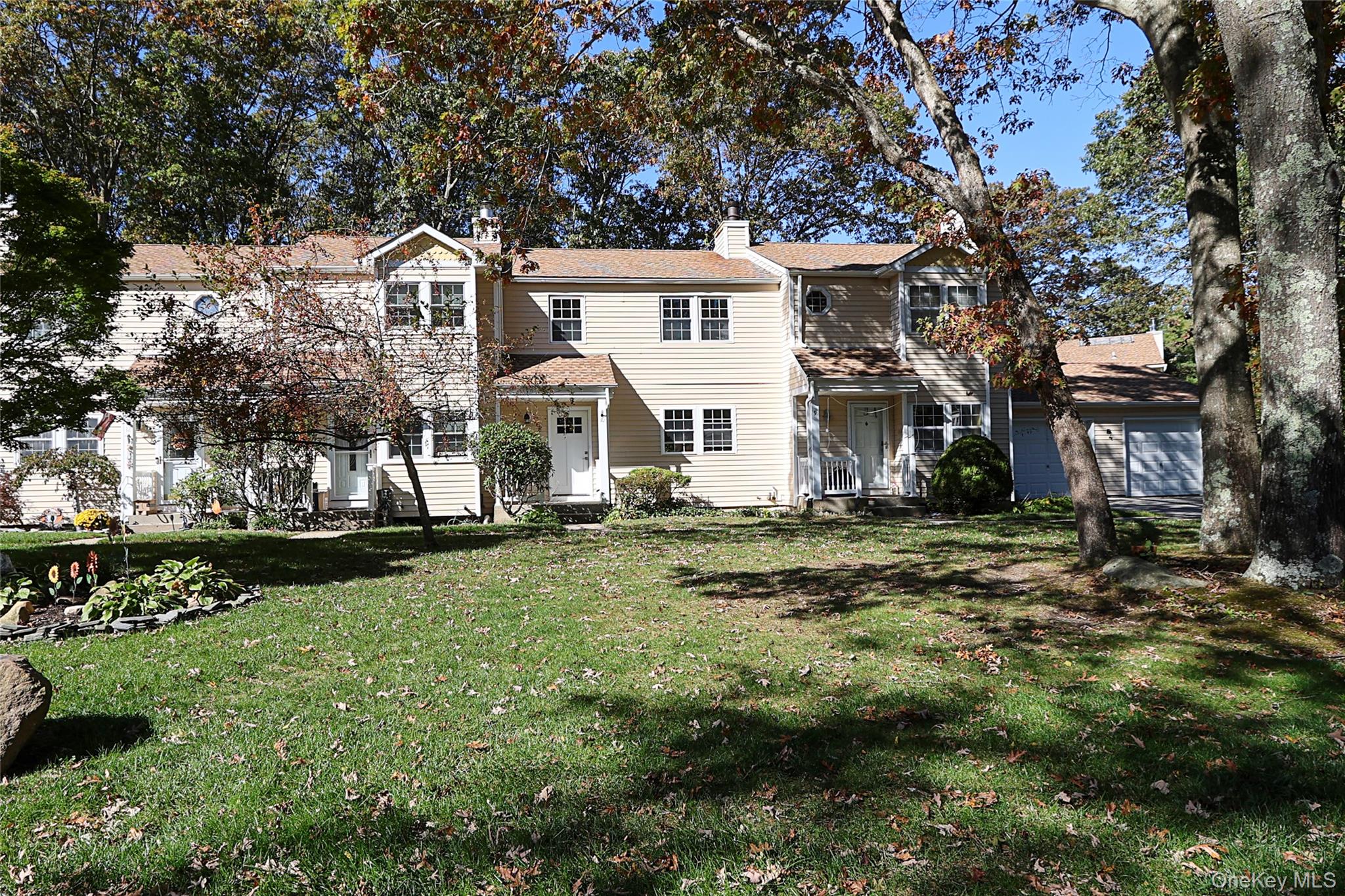 10 Smith Yaphank, NY 11980 - Photo 2 of 26 a view of a house with a yard