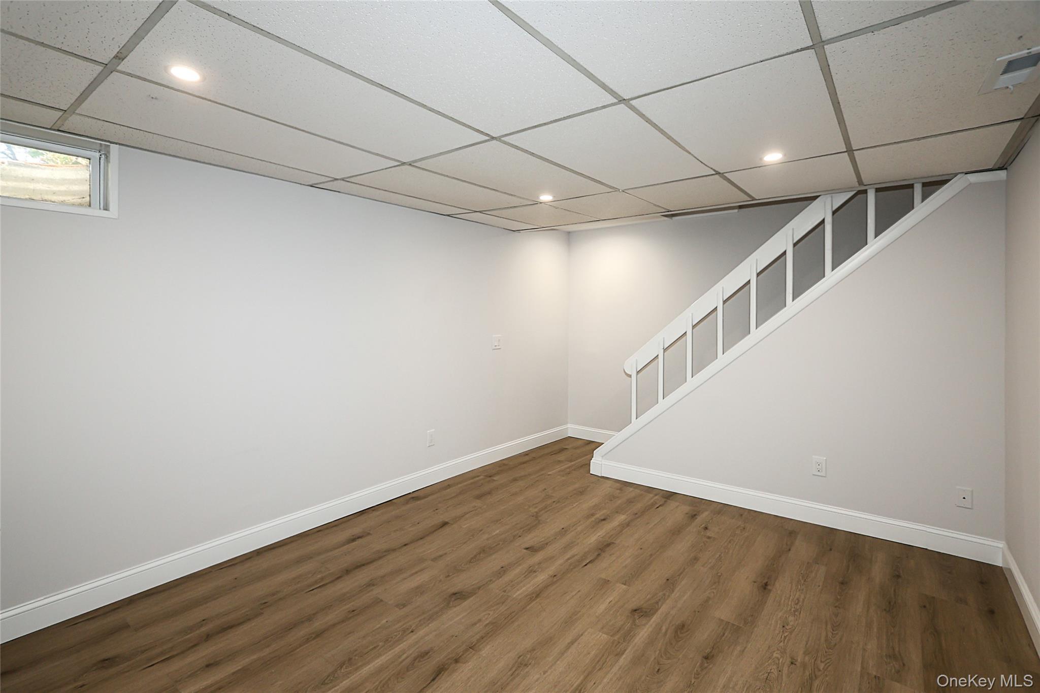 10 Smith Yaphank, NY 11980 - Photo 22 of 26 a view of an empty room with wooden floor