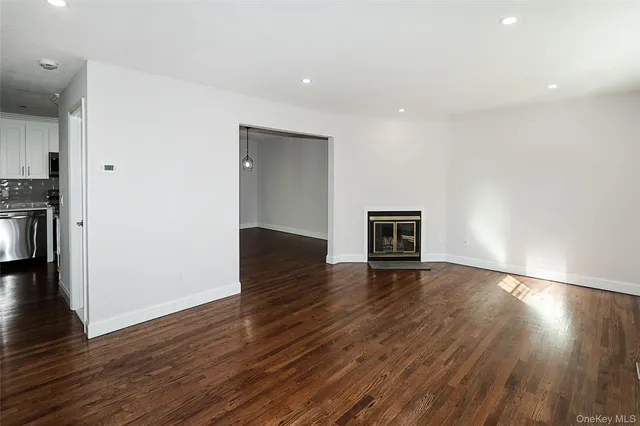 a view of a livingroom with wooden floor