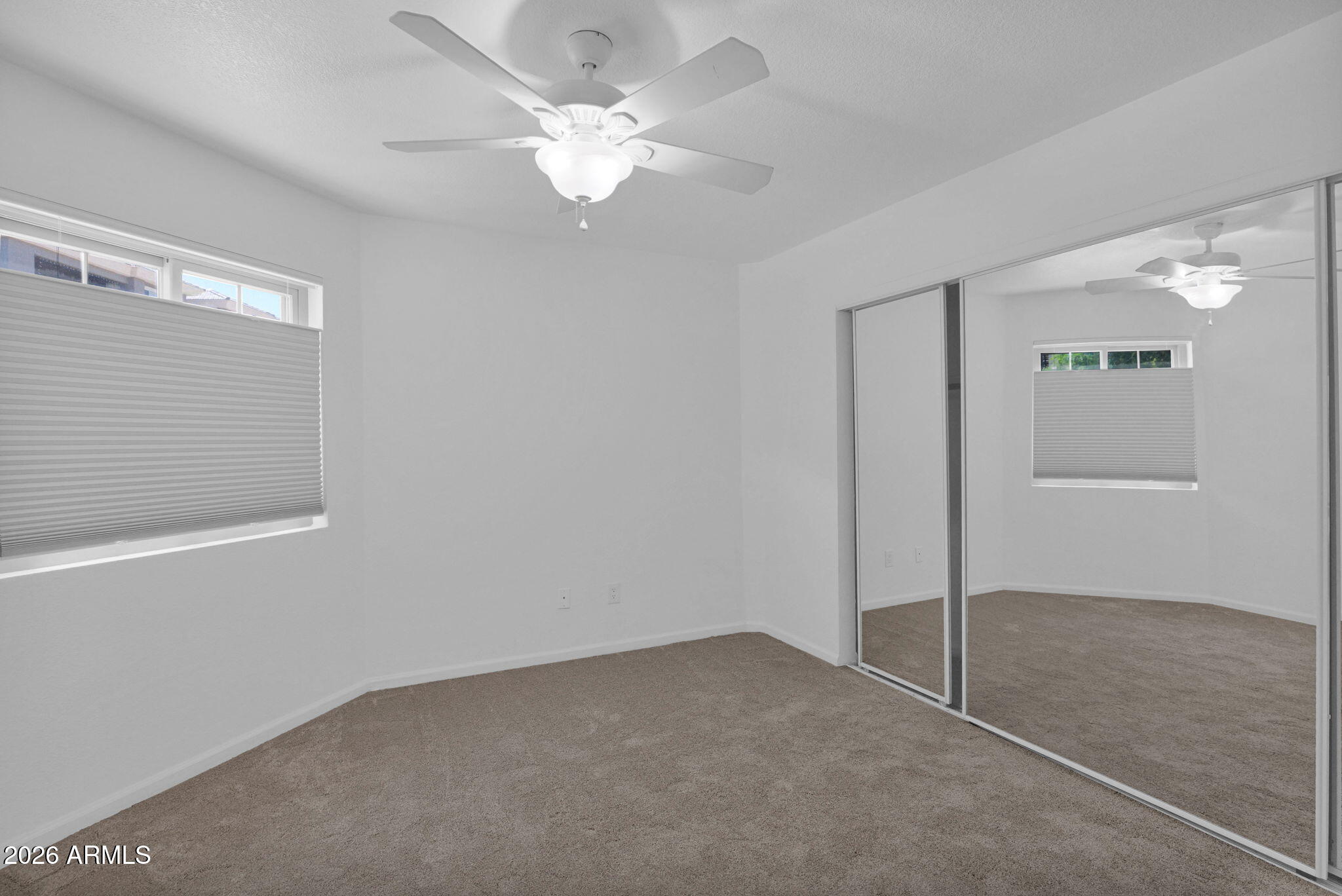 1720 East Thunderbird Road, Unit 1019 Phoenix, AZ 85022 - Photo 6 of 47 an empty room with fan