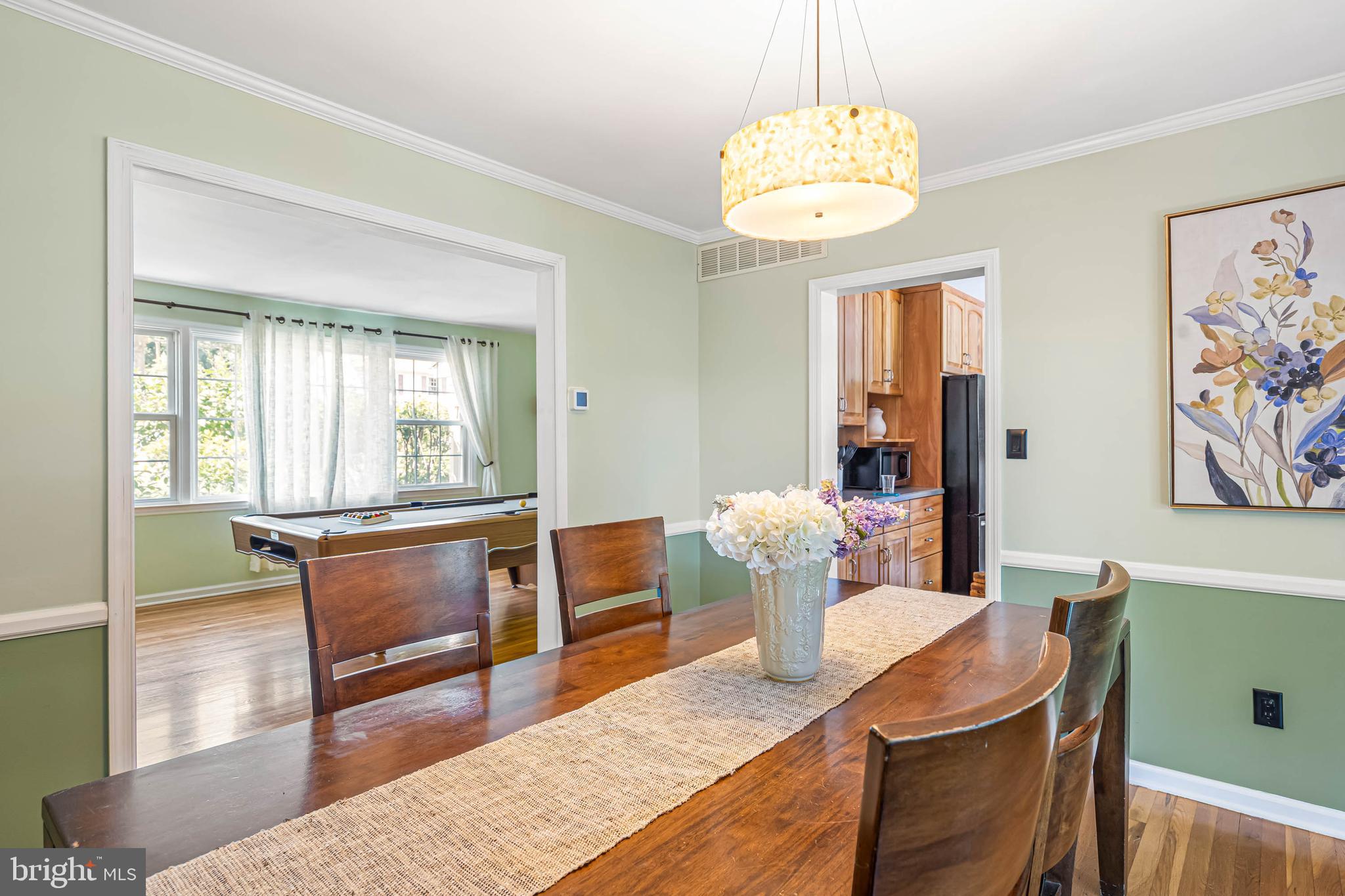 121 Decker Drive Newark, DE 19711 - Photo 13 of 57 a living room with dining table and a large window