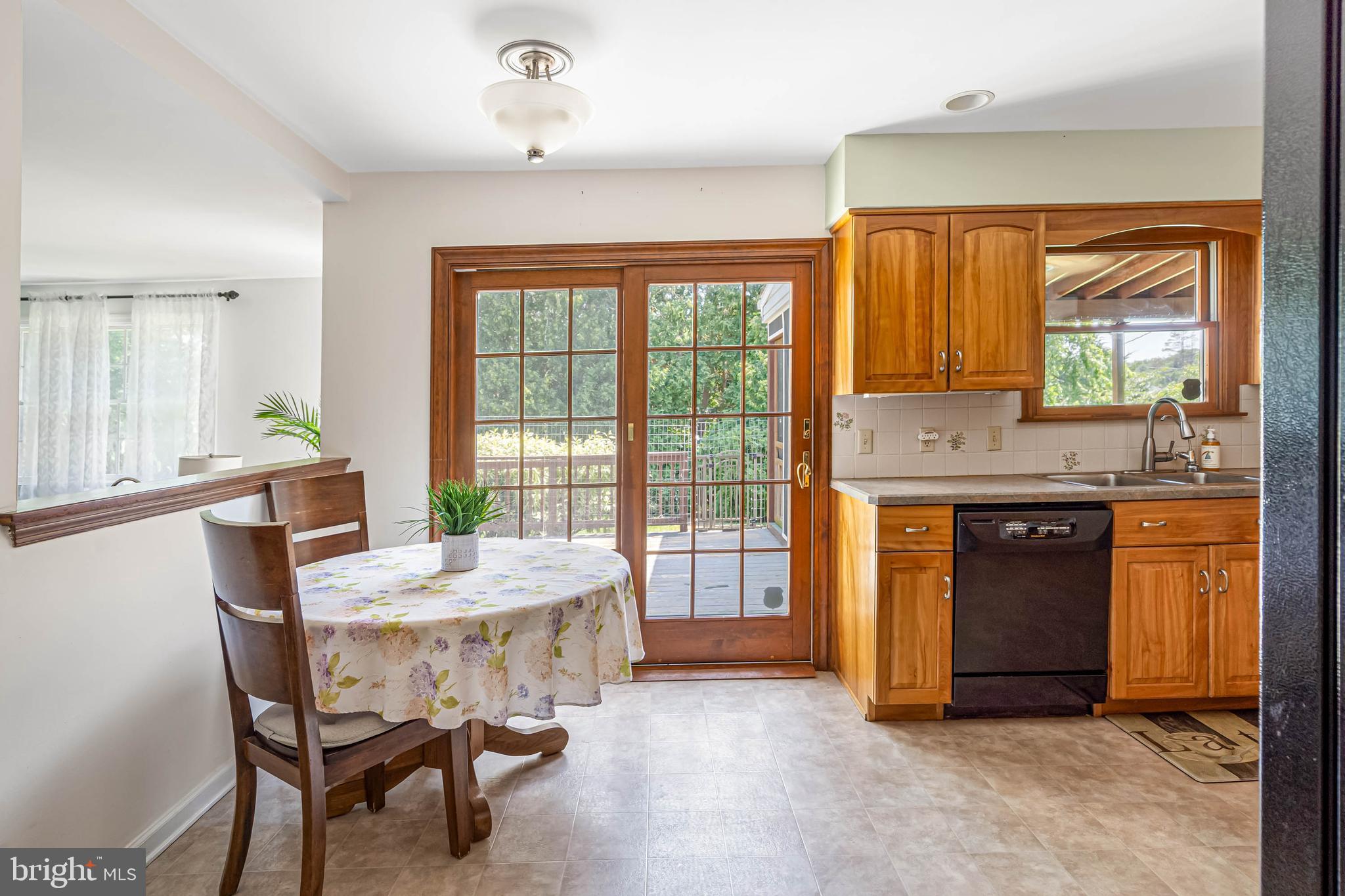 121 Decker Drive Newark, DE 19711 - Photo 15 of 57 a view of a kitchen with a table and chairs