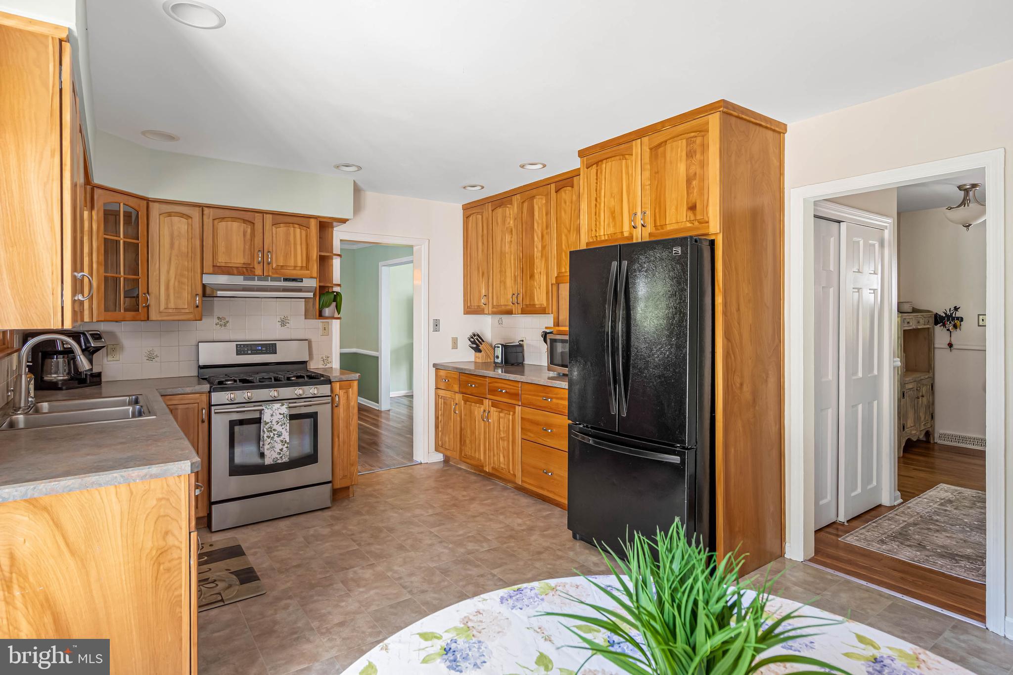 121 Decker Drive Newark, DE 19711 - Photo 17 of 57 a kitchen with stainless steel appliances granite countertop a refrigerator stove and sink