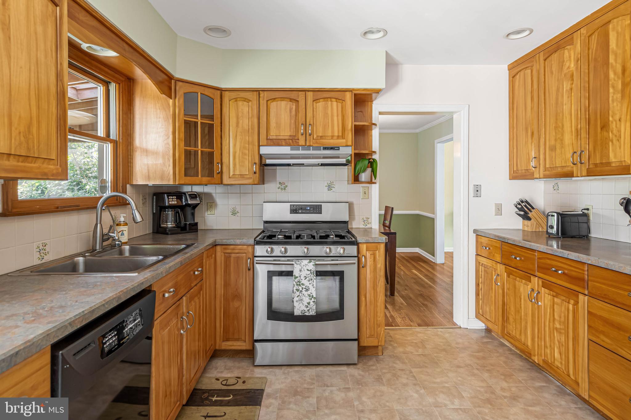121 Decker Drive Newark, DE 19711 - Photo 18 of 57 a kitchen with stainless steel appliances granite countertop a stove a sink dishwasher and a refrigerator