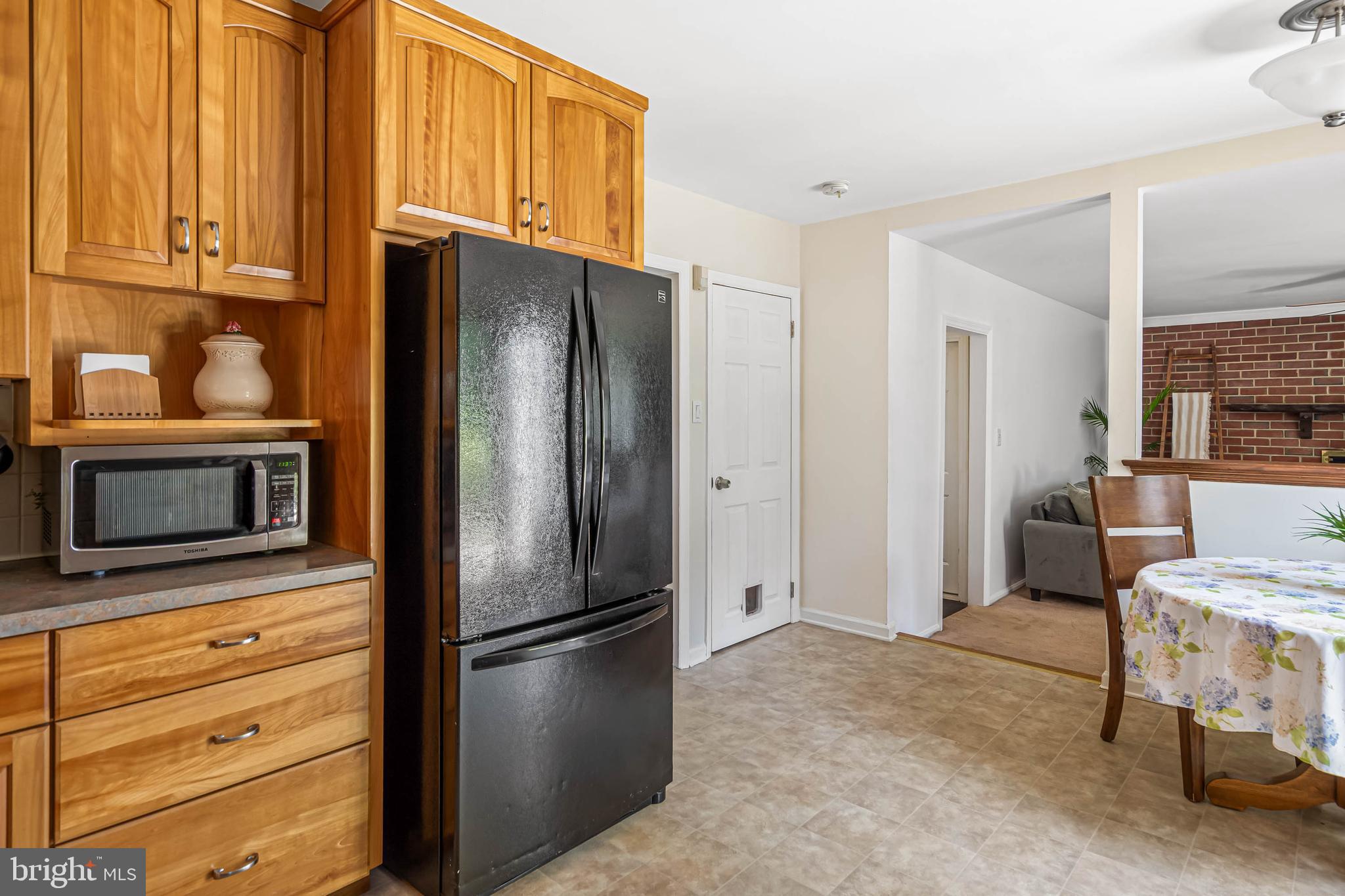 121 Decker Drive Newark, DE 19711 - Photo 19 of 57 a metallic refrigerator freezer sitting in a kitchen