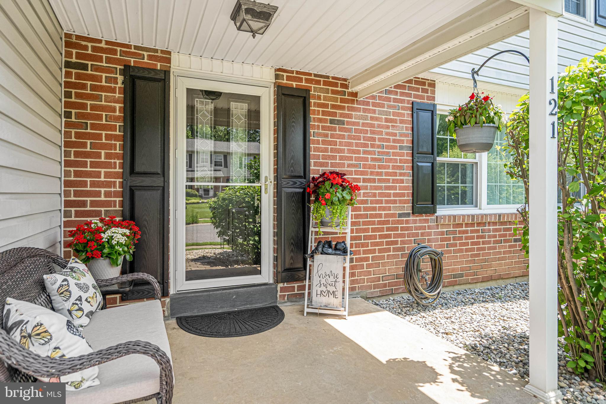 121 Decker Drive Newark, DE 19711 - Photo 2 of 57 a view of a porch with chairs and potted plants