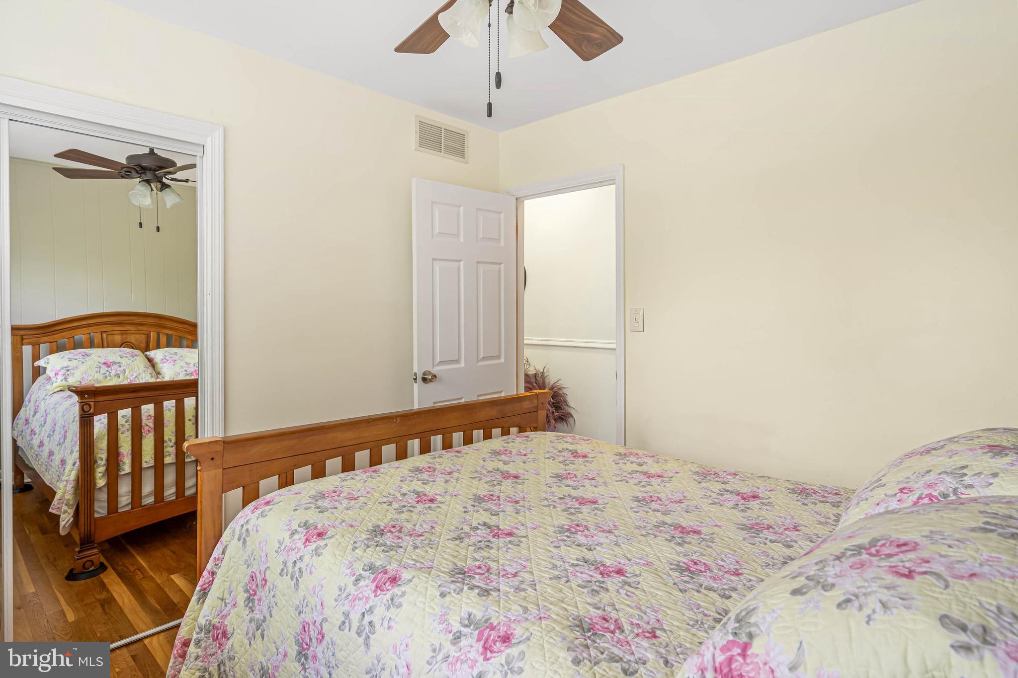121 Decker Drive Newark, DE 19711 - Photo 25 of 57 a bedroom with a bed and wooden floor